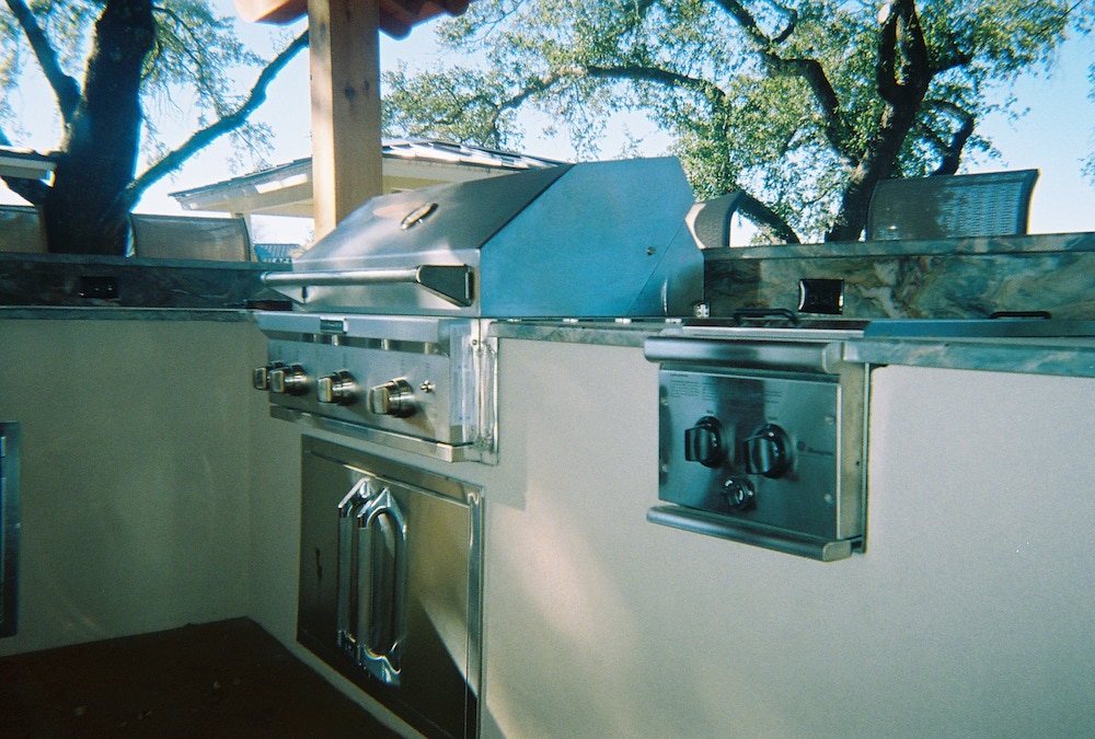 Outdoor kitchen built-in grill, stucco veneer and side burner