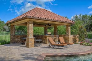 covered pergola and outdoor kitchen